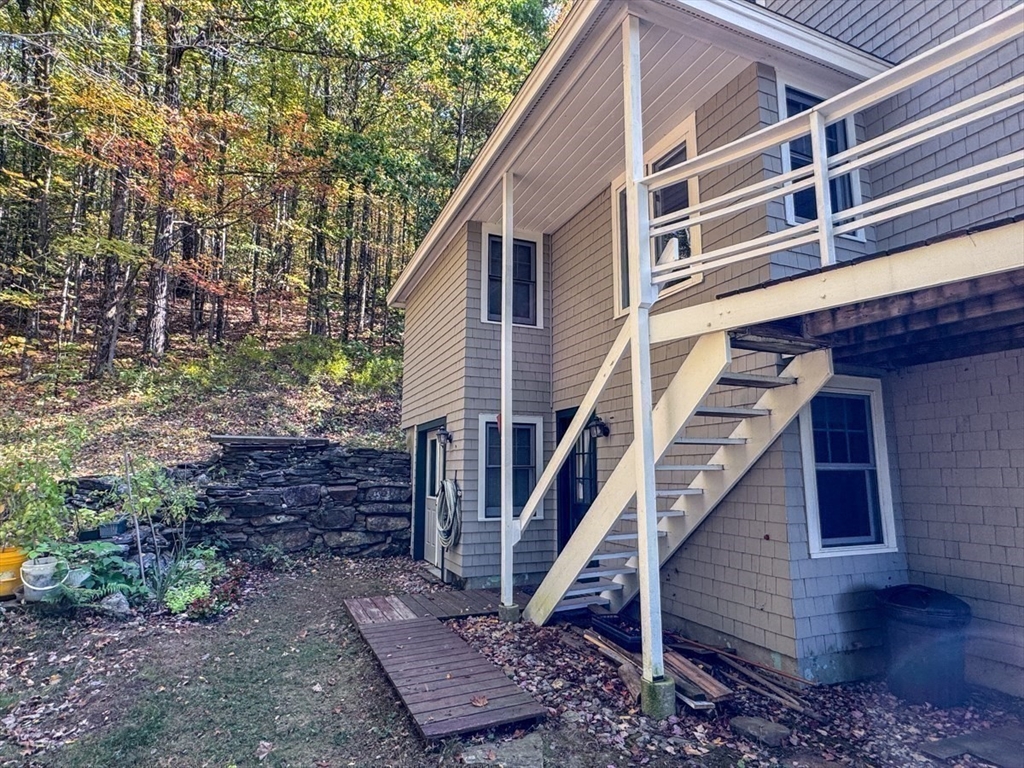 261 Old Wendell Road Northfield, MA 01360 - Photo 35 of 42 a view of a house with a yard