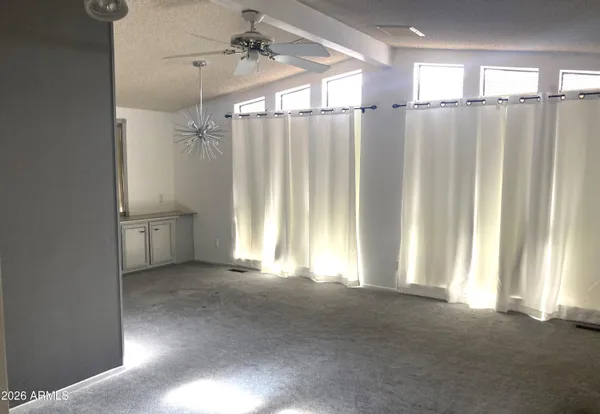 a view of entryway with wooden floor and a window