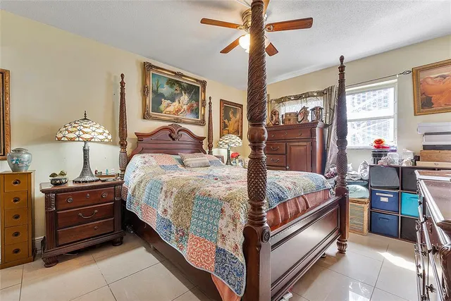 a bed room with a bed and a chandelier