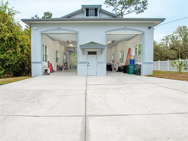a view of a hallway with wooden floor and entryway