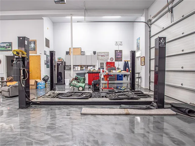 a large kitchen with a table and chairs