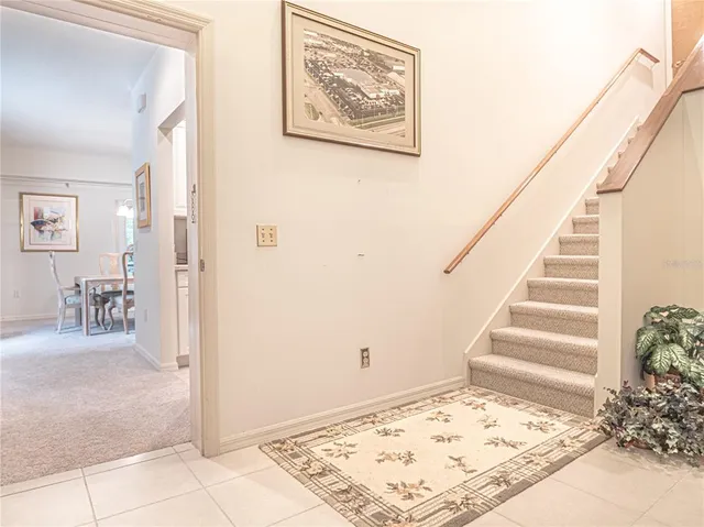a bedroom with two beds and painting on the wall