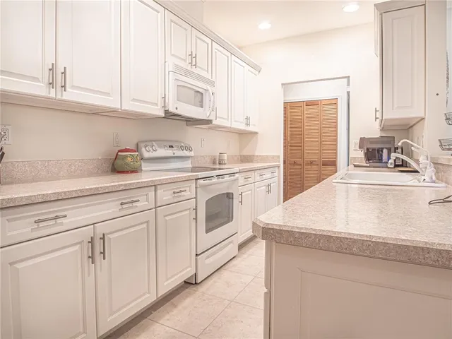 a spacious bedroom with a bed and window