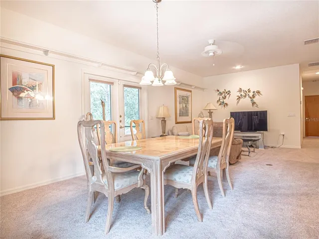 a bed room with a bed and a chair