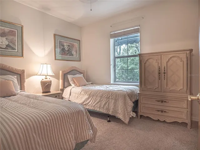 a large white kitchen with cabinets a sink and appliances