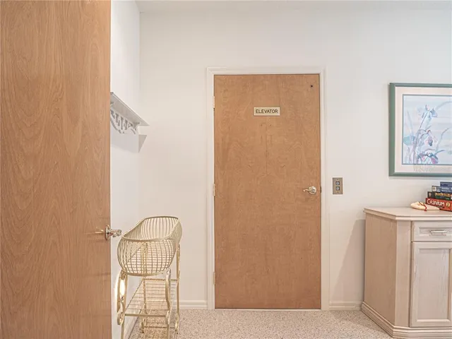 a bed room with two beds and a chandelier