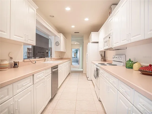 a bedroom with a bed and a chair