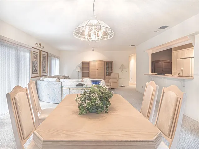 a bedroom with a bed and glass window