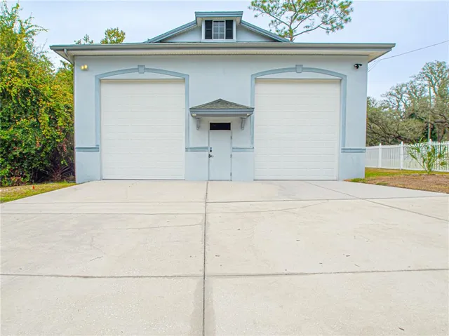 a gym room with lots of furniture and clutter
