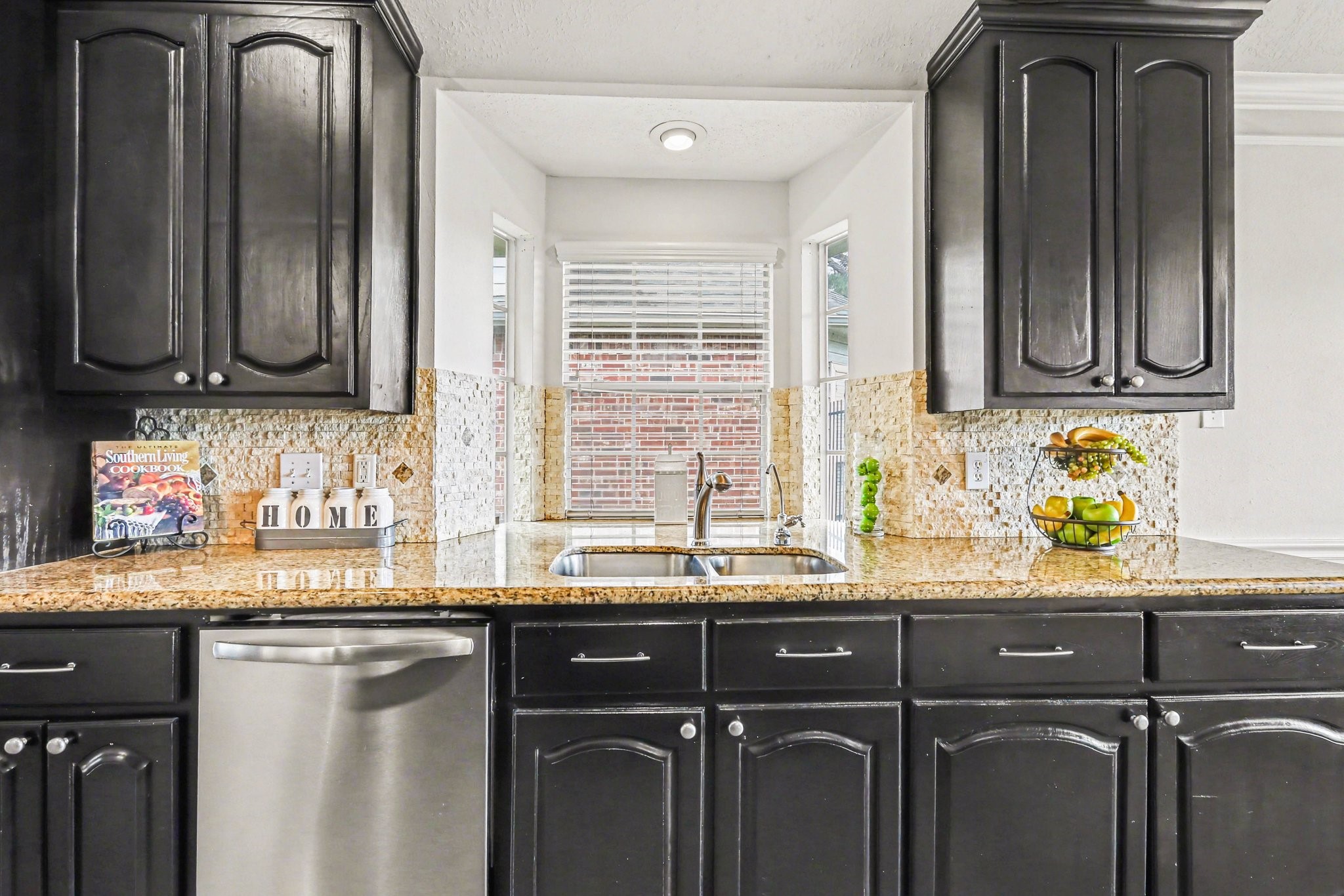 16434 Redcrest Drive Houston, TX 77095 - Photo 13 of 44 Stainless dishwasher and bay window over the sink.