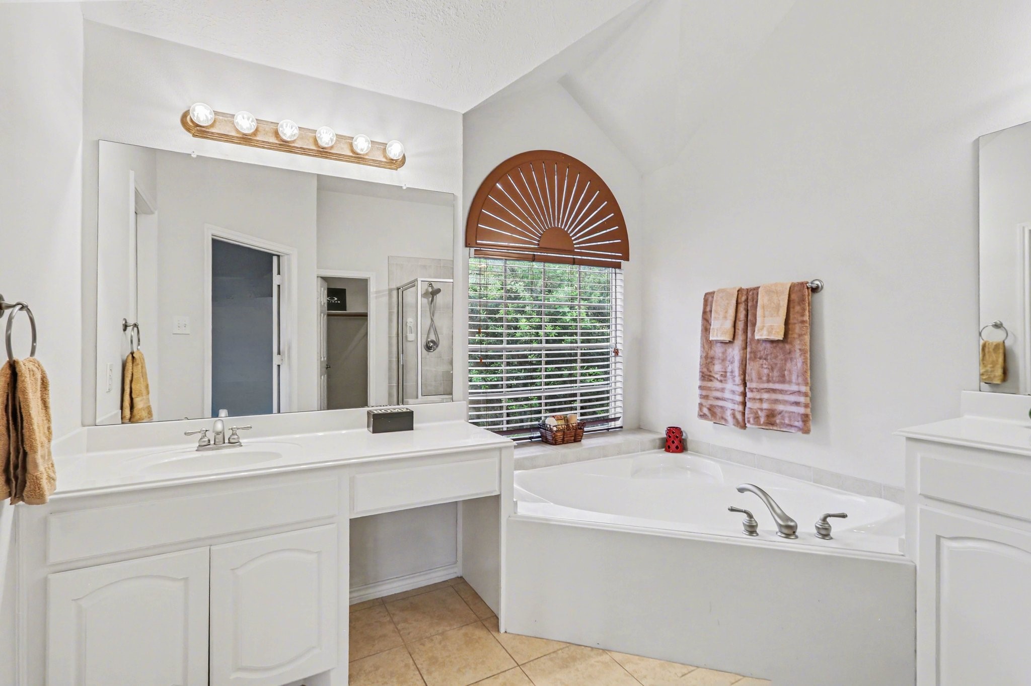 16434 Redcrest Drive Houston, TX 77095 - Photo 26 of 44 Primary bath with vanity and large corner tub.