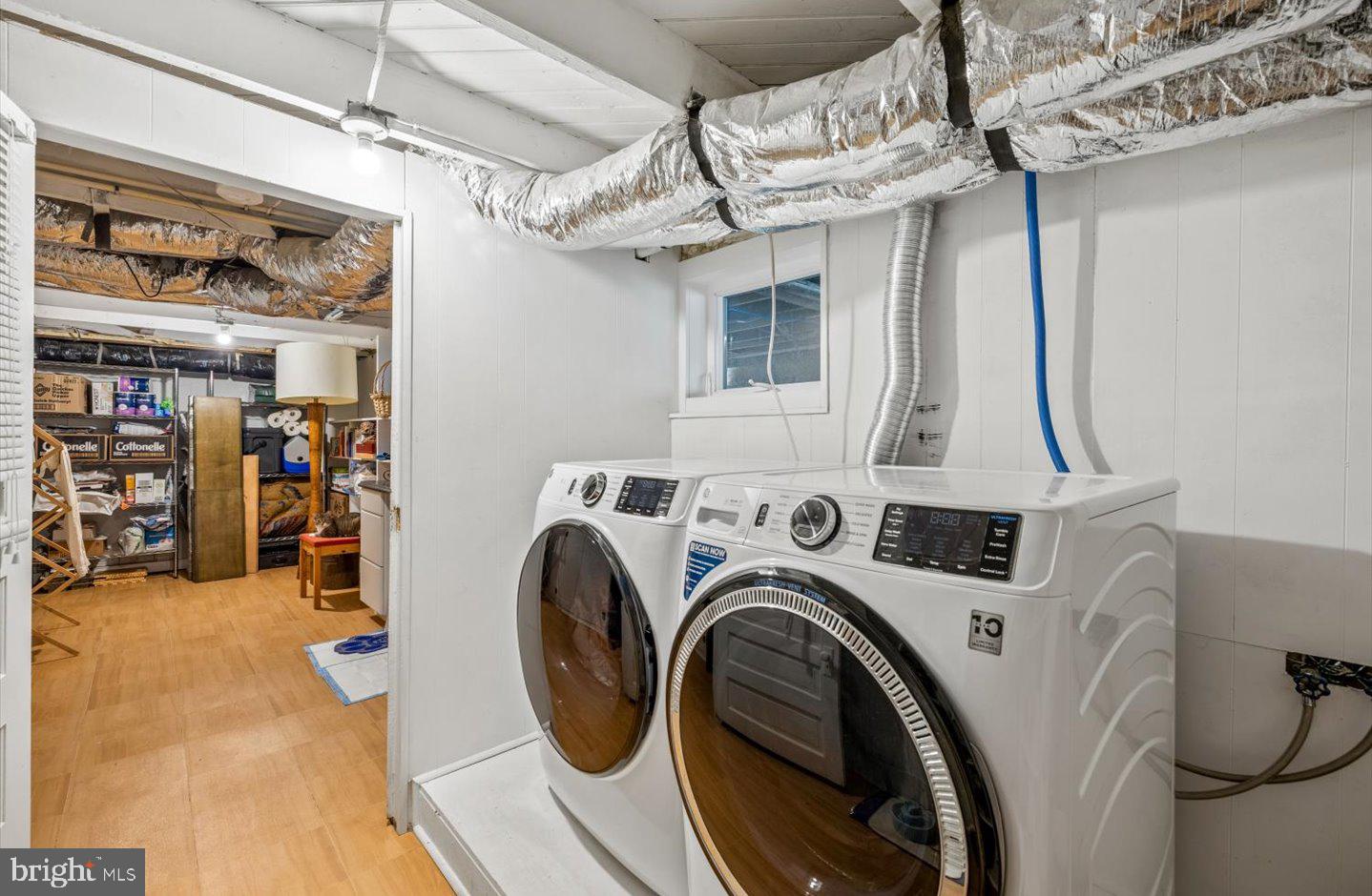 223 Rodney Street Rehoboth Beach, DE 19971 - Photo 45 of 59 a view of a storage & utility room with washer and dryer