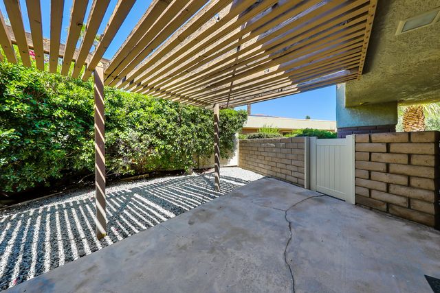 a view of a wooden door with an outdoor space