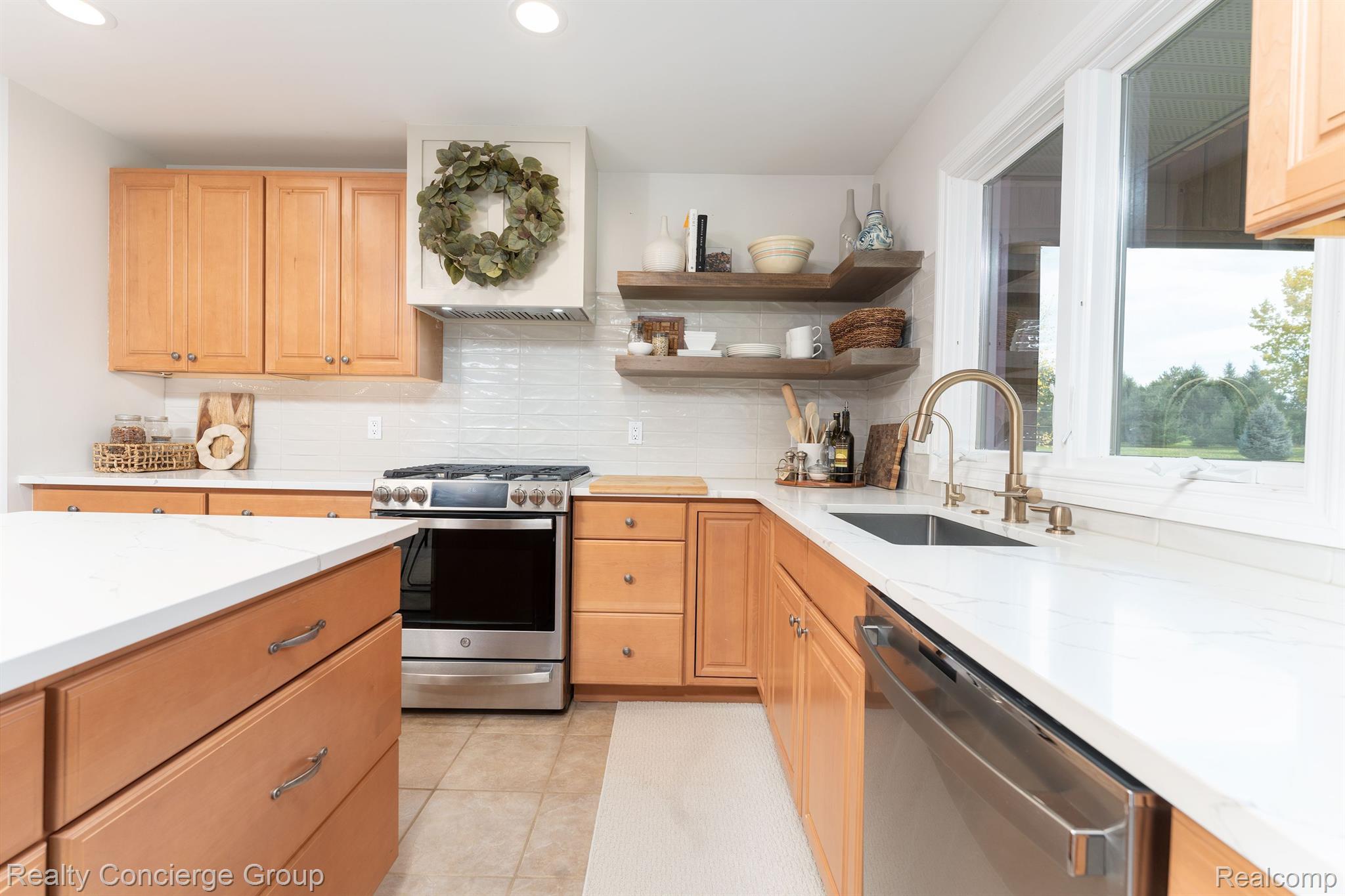 1172 Thorn Ridge Drive Howell, MI 48843 - Photo 14 of 71 counters, sleek cabinets, open shelving