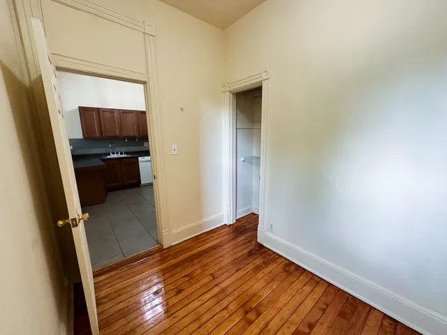 a view of an empty room with a window