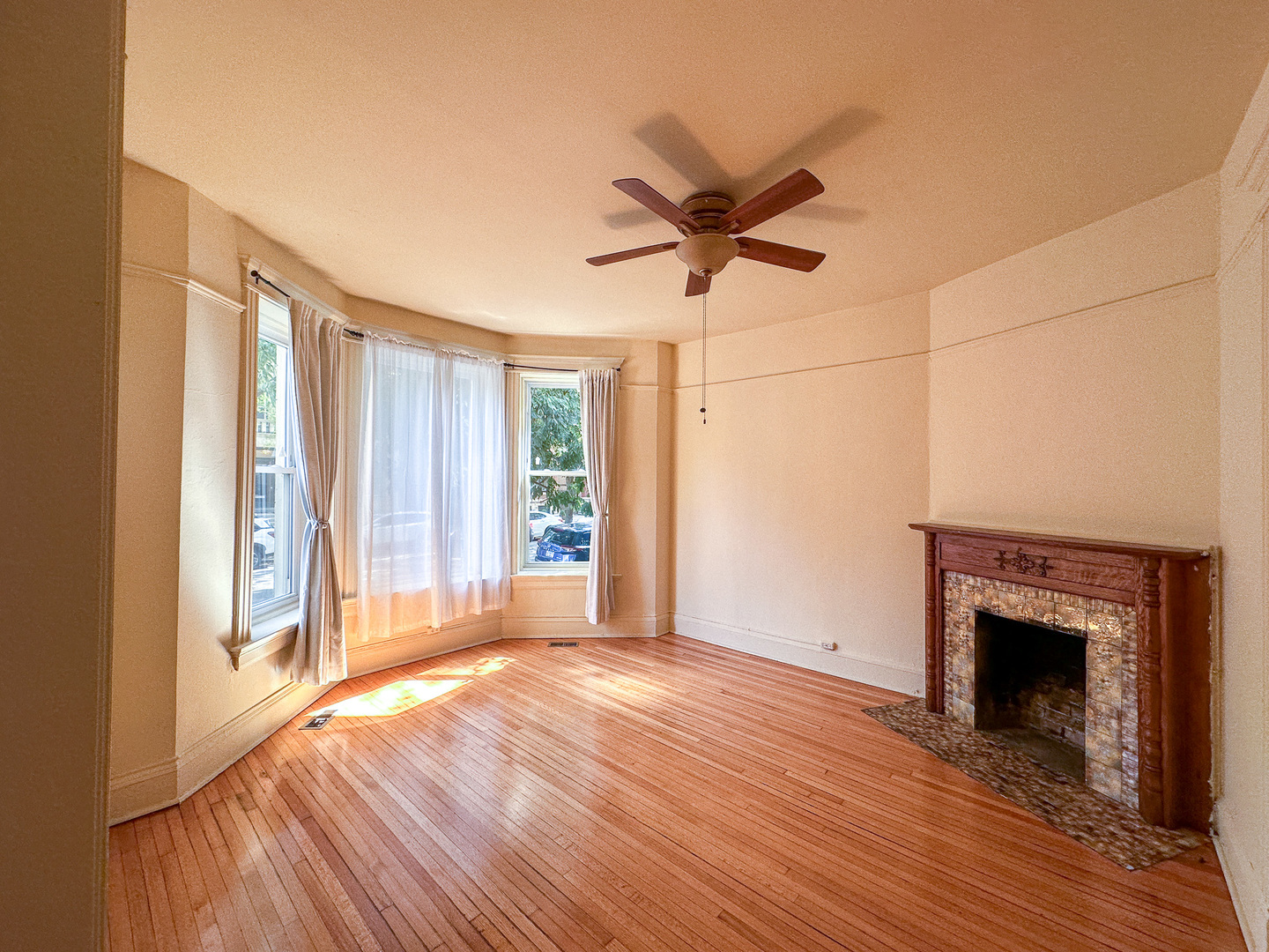 2126 North Sheffield Avenue, Unit 1 Chicago, IL 60614 - Photo 15 of 24 a view of empty room with wooden floor and fan
