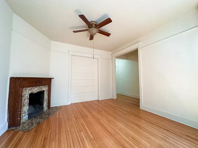 a bedroom with a bed and a fireplace