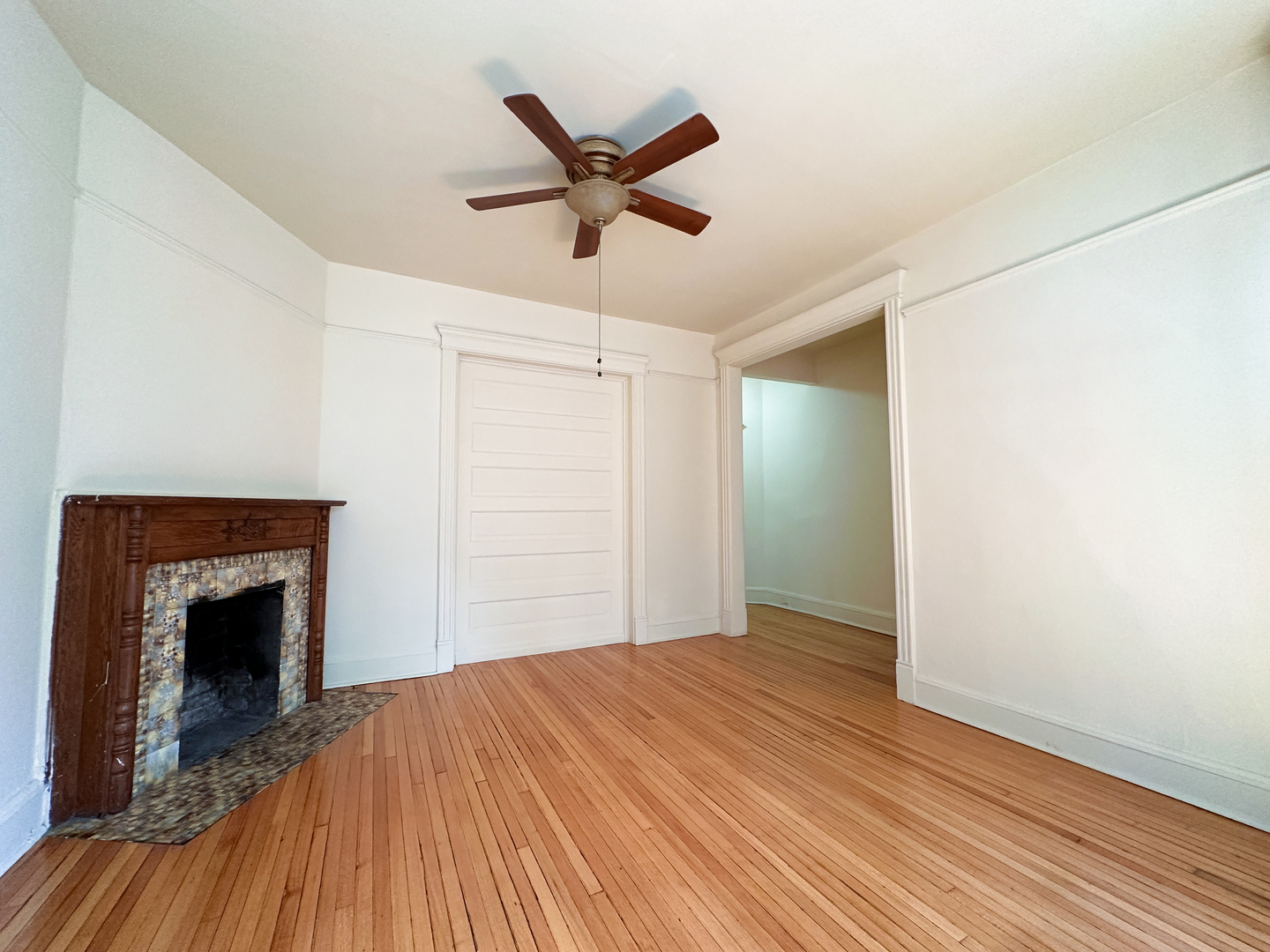 2126 North Sheffield Avenue, Unit 1 Chicago, IL 60614 - Photo 17 of 24 a bedroom with a bed and a fireplace