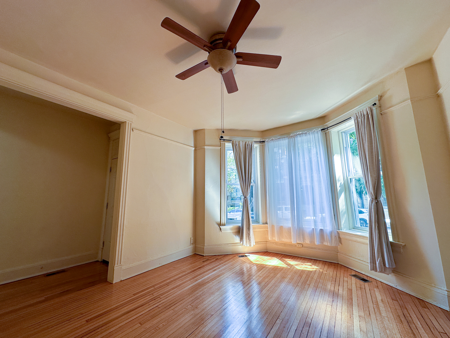 2126 North Sheffield Avenue, Unit 1 Chicago, IL 60614 - Photo 18 of 24 a view of room with wooden floor and ceiling fan