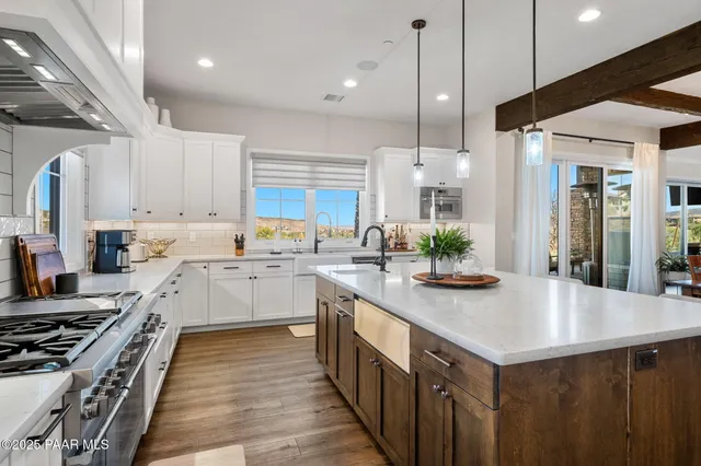a kitchen with a counter space cabinets and appliances