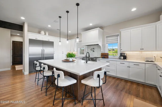 a bathroom with a sink a mirror and a shower