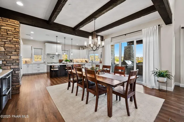 a view of a walk in closet with clothes and shoes