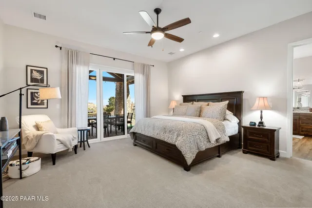 a bedroom with furniture and a window