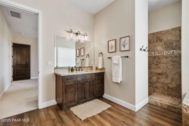 a view of a balcony with furniture and a floor to ceiling window