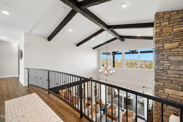 an aerial view of a house with a mountain