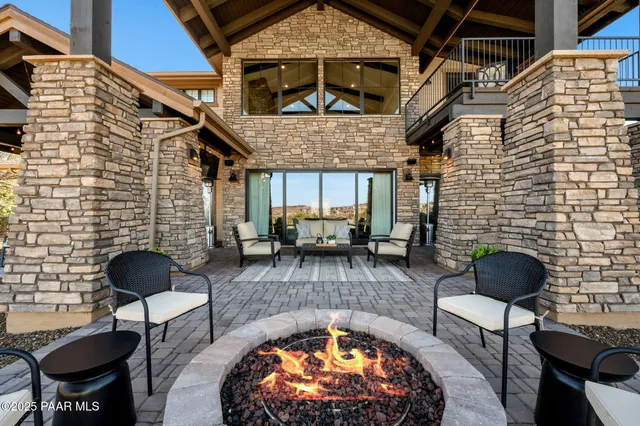 a kitchen with stainless steel appliances lots of counter space and furniture