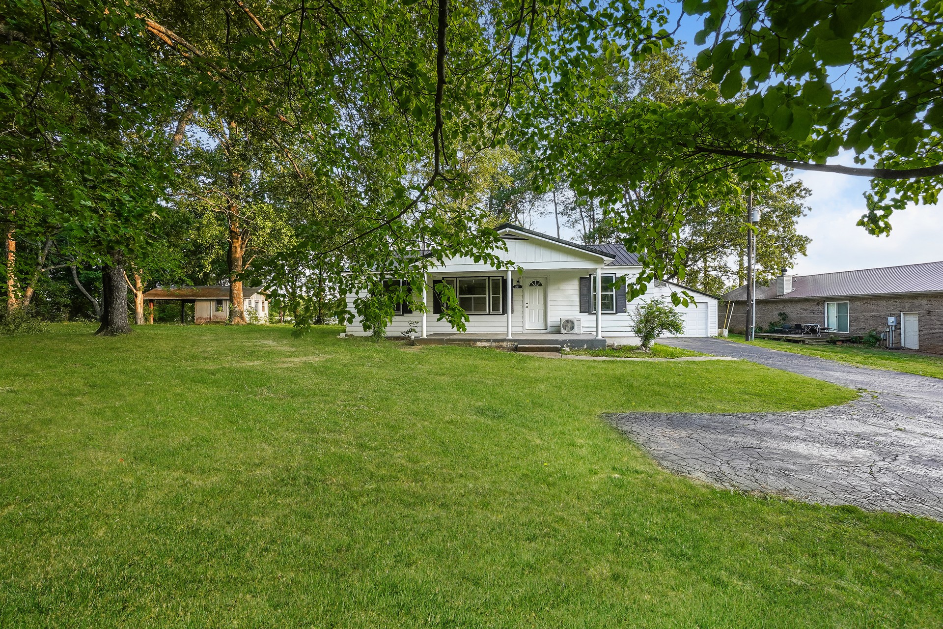 231 Foston Chapel Road Hopkinsville, KY 42240 - Photo 1 of 20 a view of house that has a yard