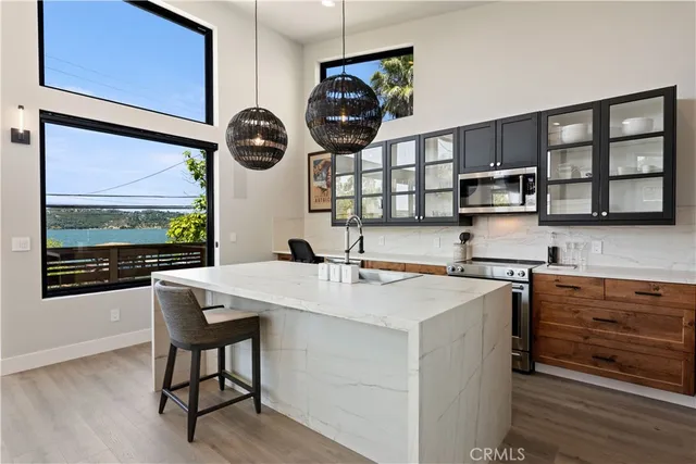 a kitchen with a stove microwave and cabinets