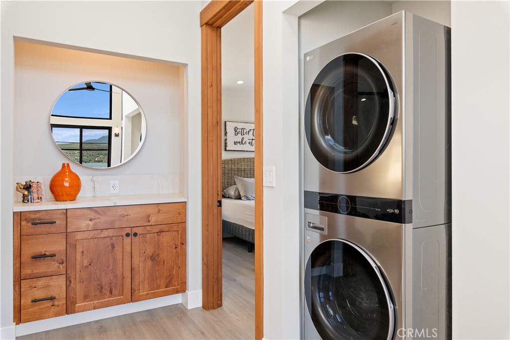 12630 Lakeshore Drive Clearlake, CA 95422 - Photo 22 of 73 a view of a hallway with washer and dryer