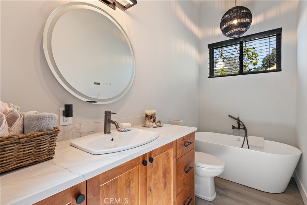 12630 Lakeshore Drive Clearlake, CA 95422 - Photo 23 of 73 a bathroom with a sink and a mirror