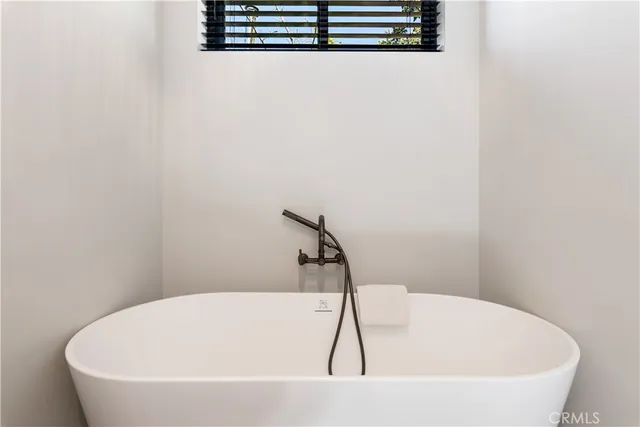 a bedroom with a bed and a view of bedroom