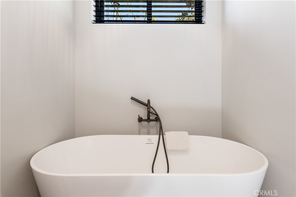 12630 Lakeshore Drive Clearlake, CA 95422 - Photo 24 of 73 a white bath tub sitting in a bathroom