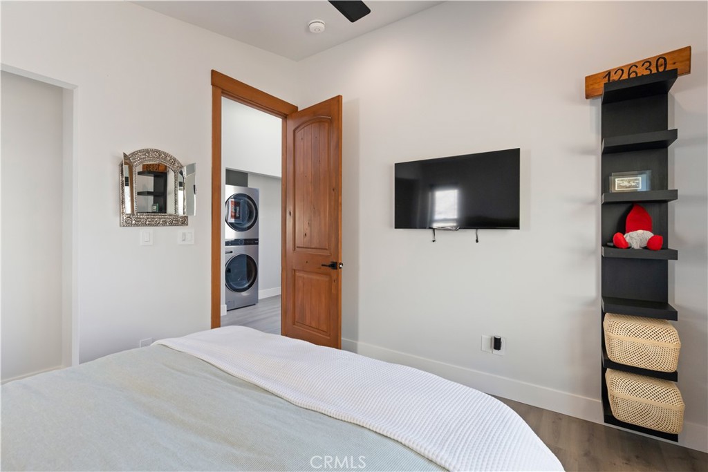 12630 Lakeshore Drive Clearlake, CA 95422 - Photo 26 of 73 a bedroom with a bed and a flat screen tv