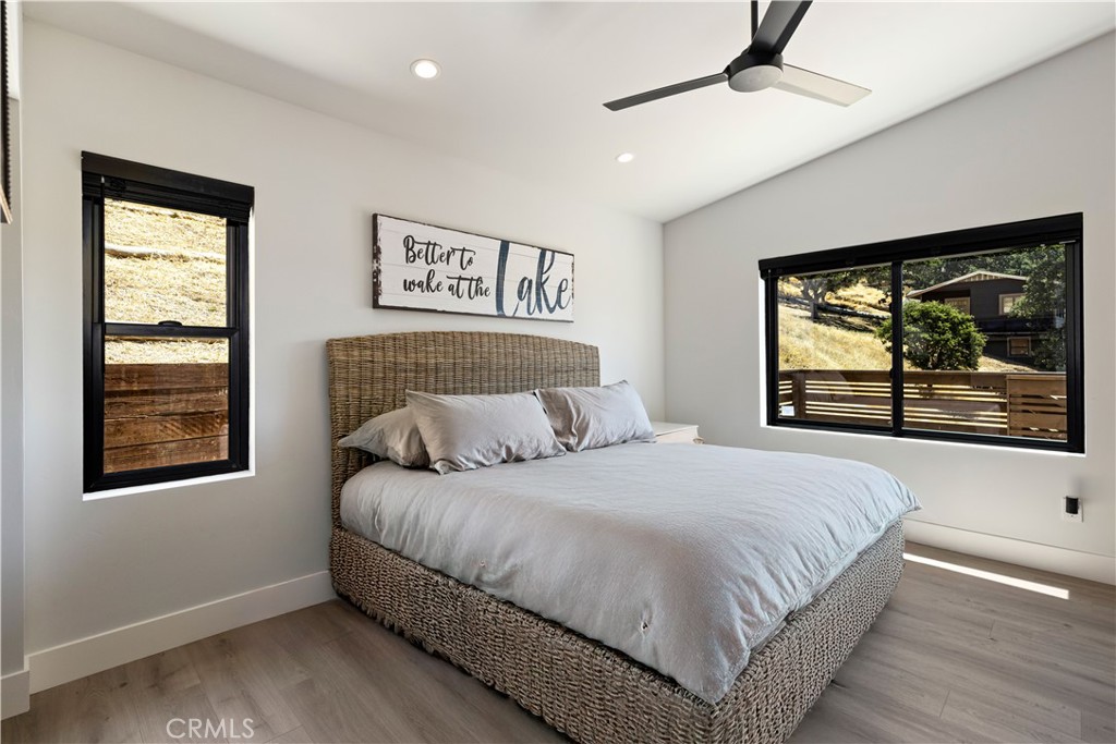 12630 Lakeshore Drive Clearlake, CA 95422 - Photo 27 of 73 a bedroom with a large bed and a window