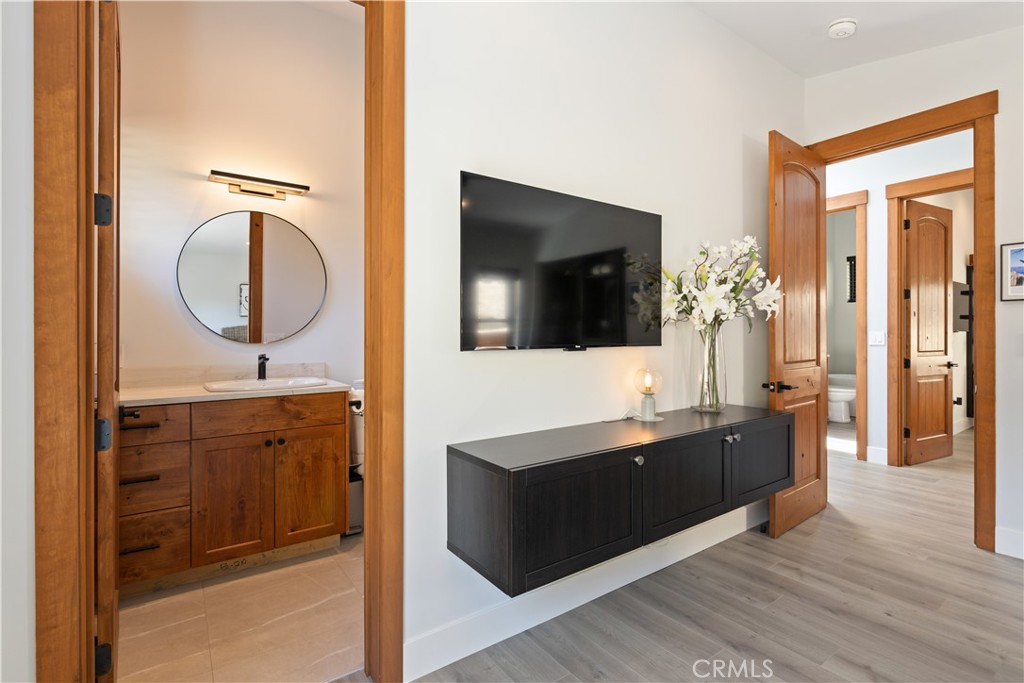 12630 Lakeshore Drive Clearlake, CA 95422 - Photo 30 of 73 a spacious bathroom with a sink and a mirror