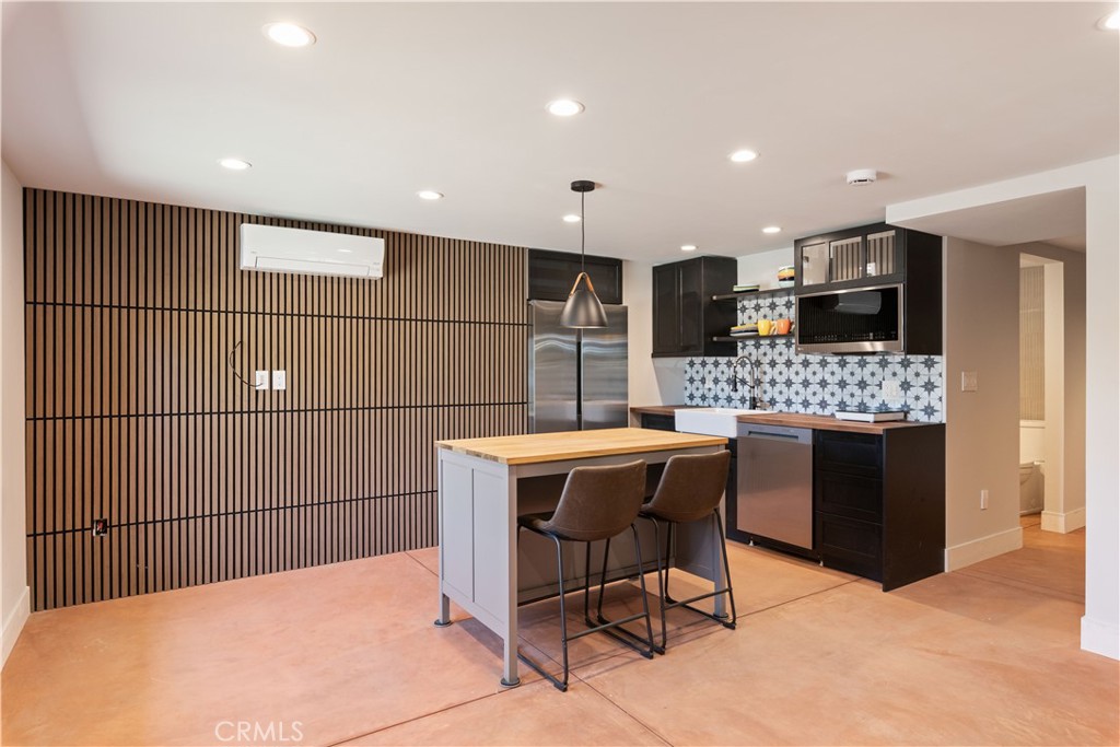 12630 Lakeshore Drive Clearlake, CA 95422 - Photo 38 of 73 a kitchen with stainless steel appliances kitchen island granite countertop a sink and cabinets