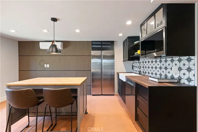 an aerial view of residential houses with yard