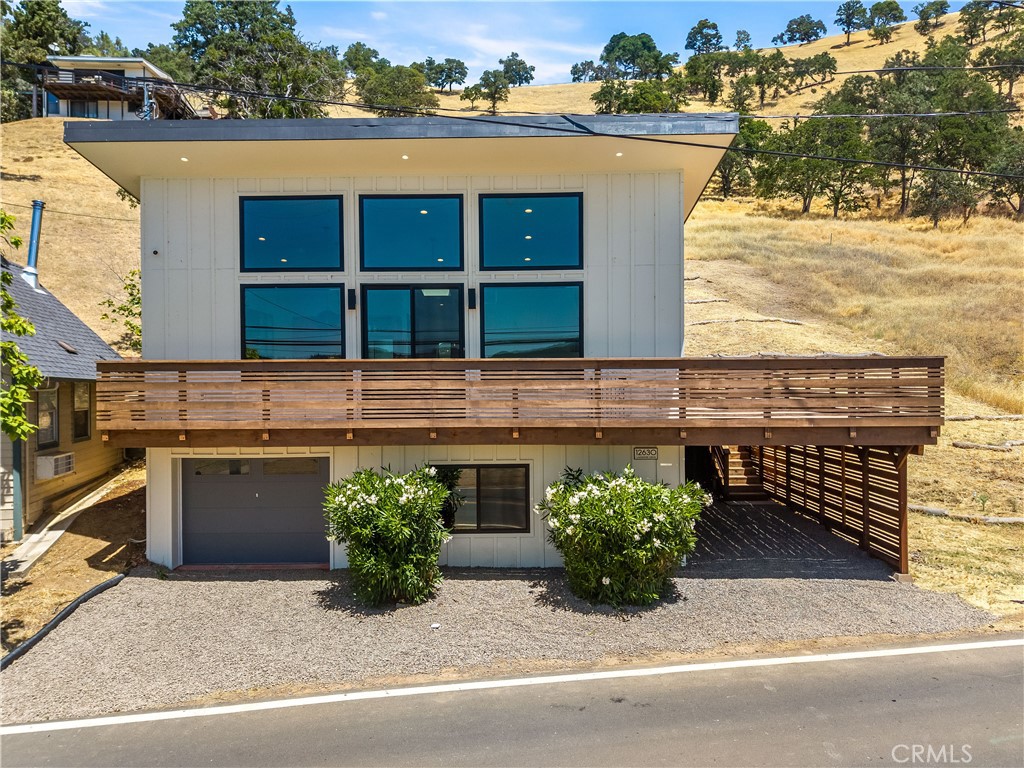 12630 Lakeshore Drive Clearlake, CA 95422 - Photo 5 of 73 a view of a house with a patio