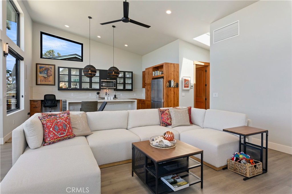 12630 Lakeshore Drive Clearlake, CA 95422 - Photo 9 of 73 a living room with furniture kitchen view and a chandelier