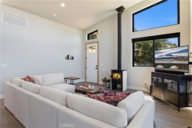 a living room with furniture fireplace and flat screen tv