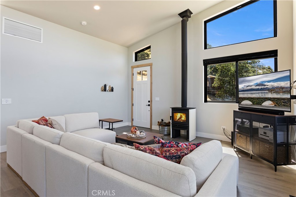12630 Lakeshore Drive Clearlake, CA 95422 - Photo 10 of 73 a living room with furniture and a flat screen tv