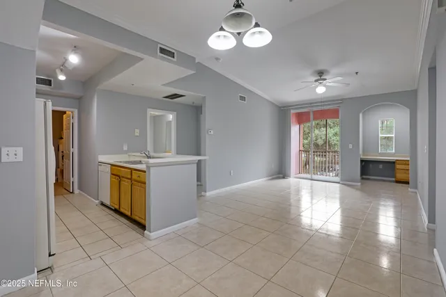 a view of a kitchen with a sink and cabinet with wooden floor