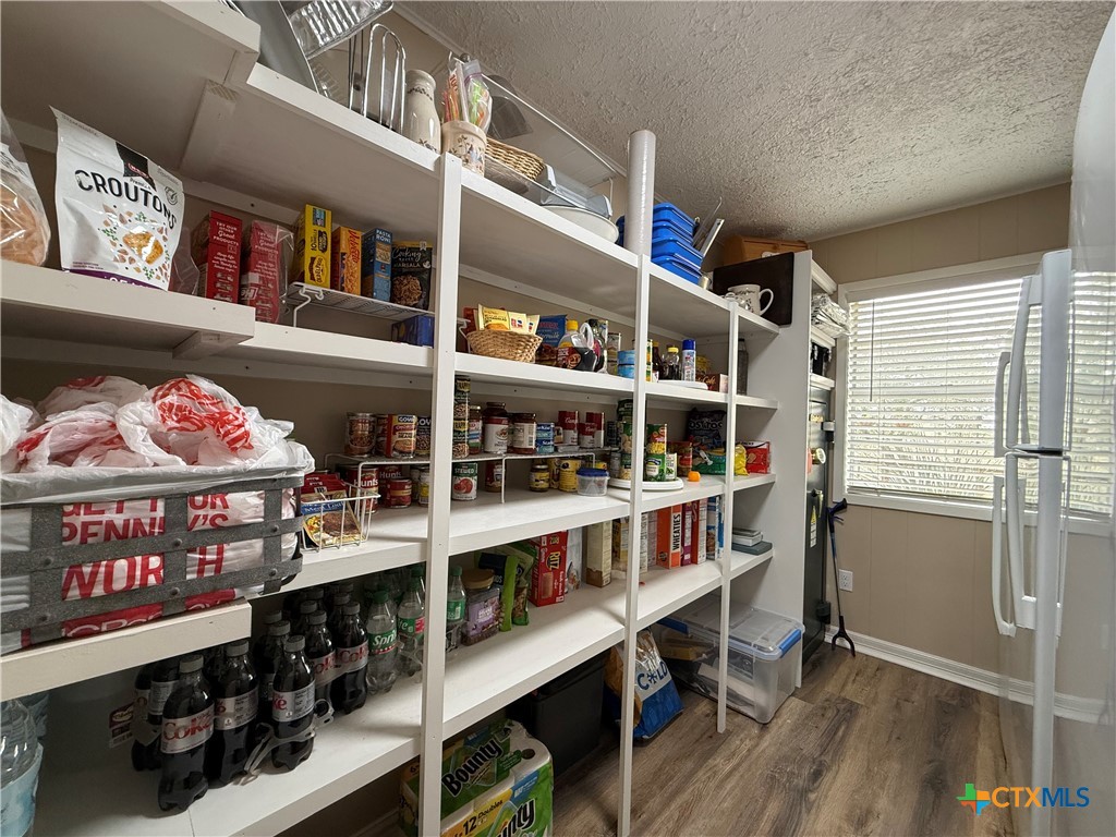 2701 Leary Lane Victoria, TX 77901 - Photo 21 of 48 a room with lots of books and a large window
