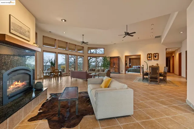 a view of a hallway with wooden floor and furniture