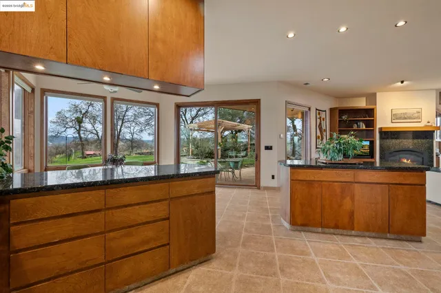 a living room with a large window and a table