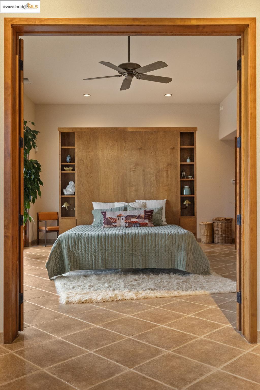 25775 Powell Ranch Road Sonora, CA 95370 - Photo 27 of 60 a bedroom with a bed and a cabinets